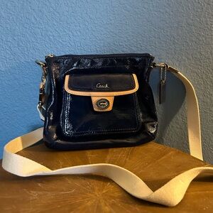 Coach- Mint condition Blue wet look purse.